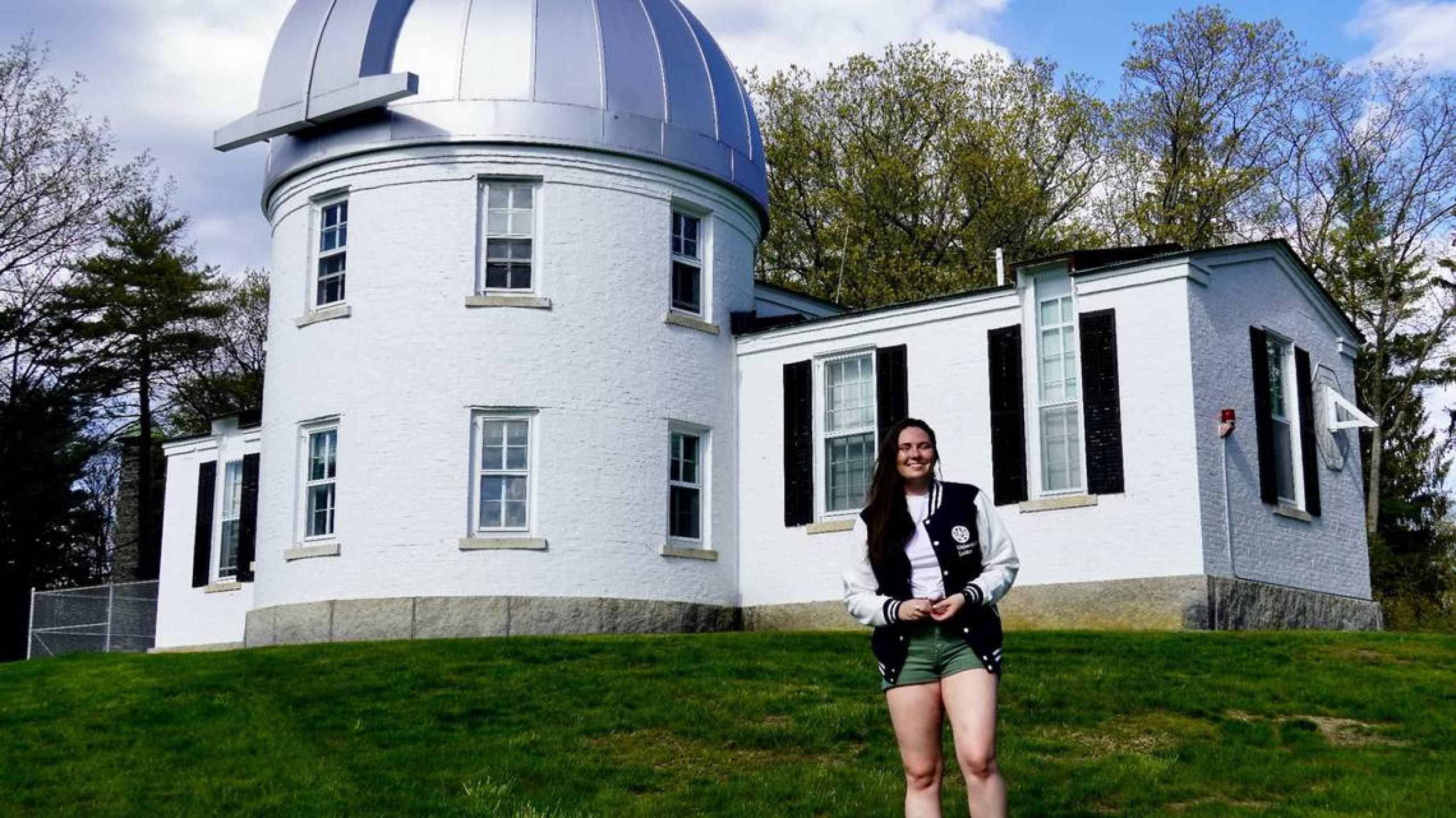 Photo of Catherine Slaughter, Central Idaho Dark Sky Reserve’s new astronomer-in-residence, standing in front of the Shattuck Observatory at Catherine’s alma mater, Dartmouth.